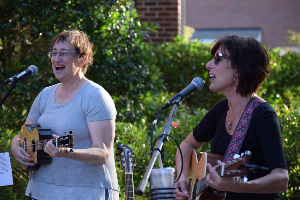 Leah Kaufman and Isabel Taylor; Leah with ukulele, Isabel on guitar. Performance at La Vita Dolce, June 2016